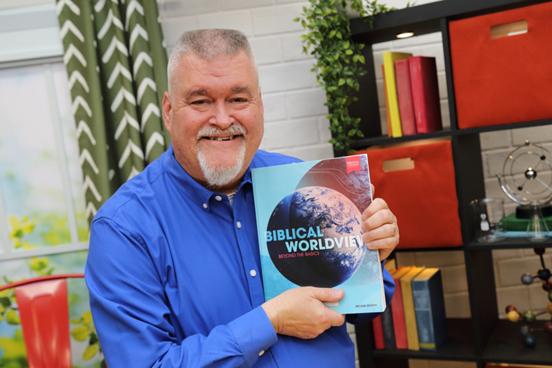 the teacher showing the textbook