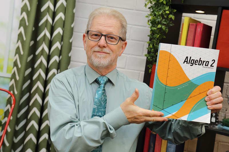 the teacher showing the textbook