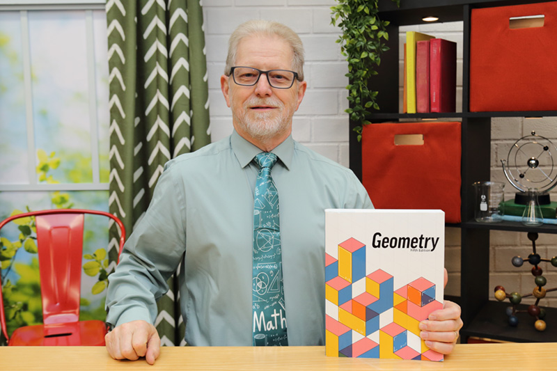 the teacher showing the textbook