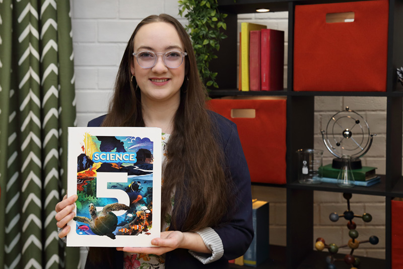 the teacher showing the textbook