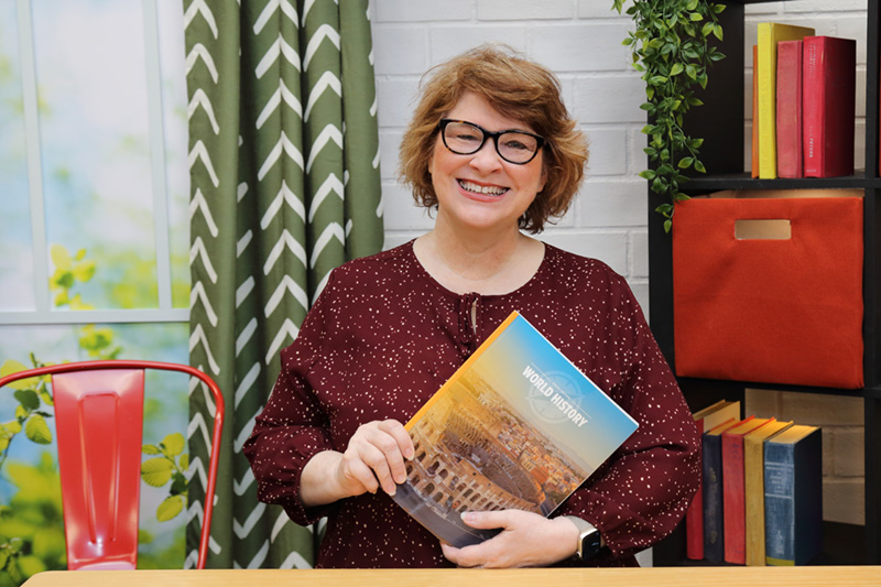 the teacher showing the textbook