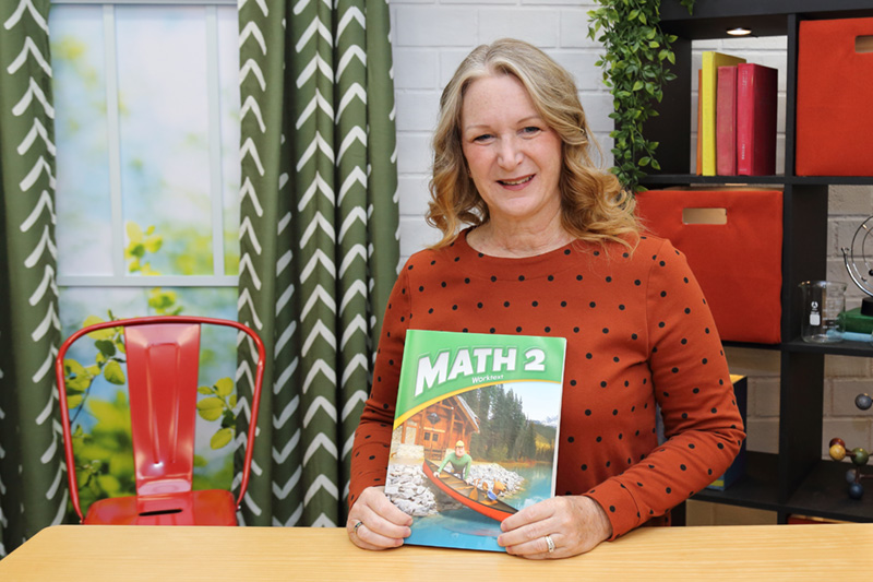 the teacher showing the textbook