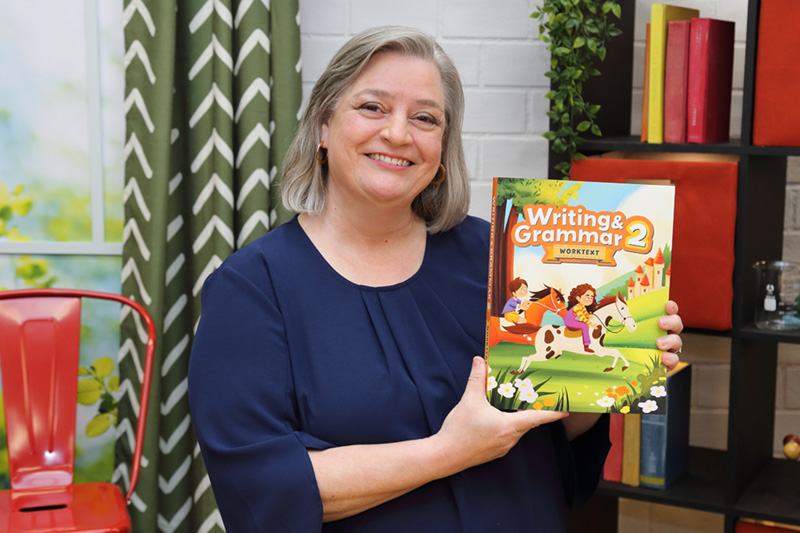 the teacher showing the textbook