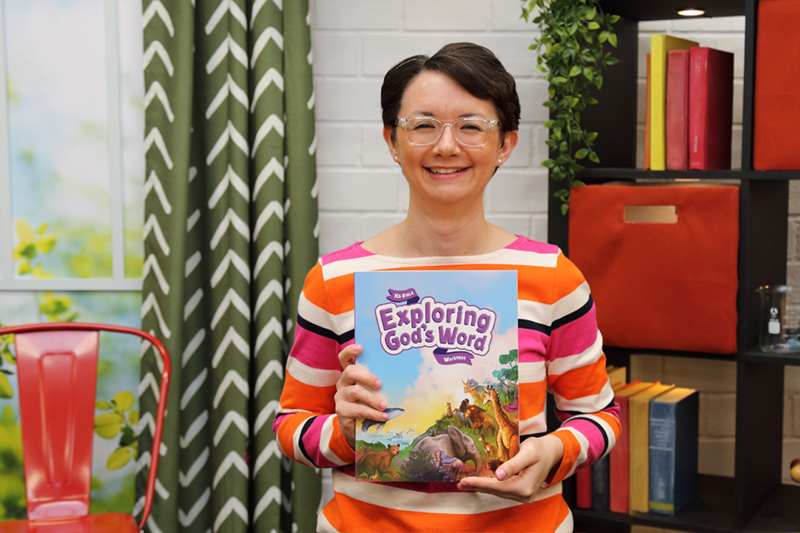 the teacher showing the textbook