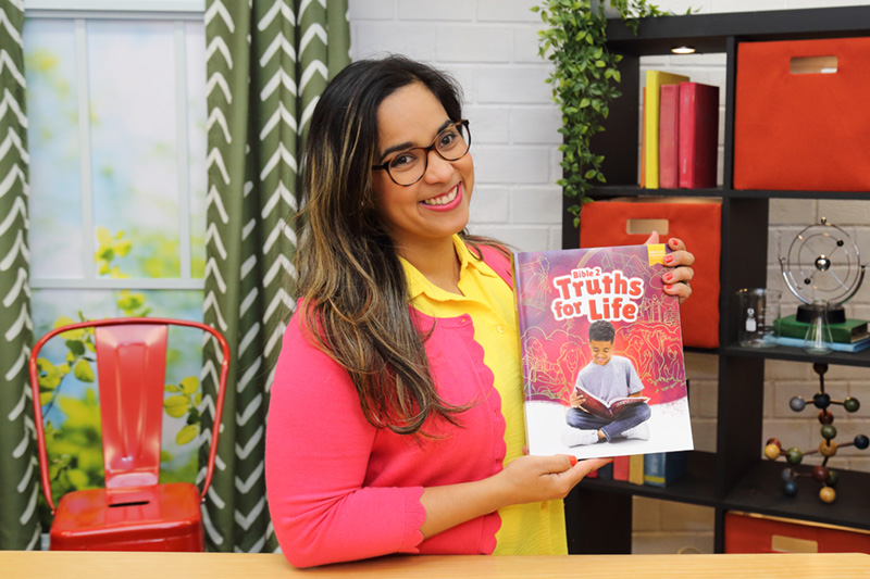 the teacher showing the textbook