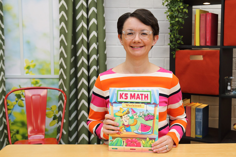 the teacher showing the textbook