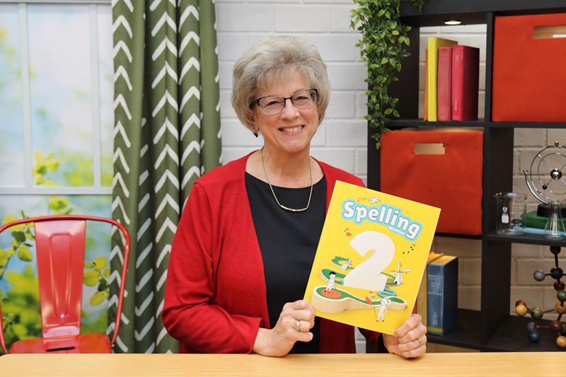 the teacher showing the textbook