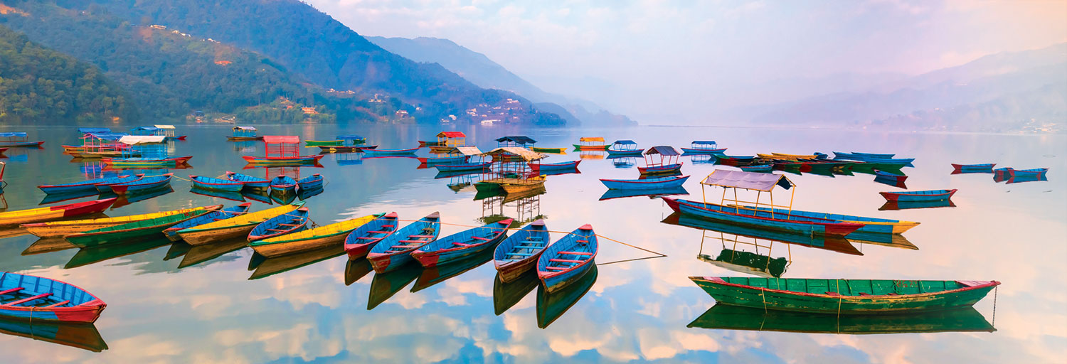 colorful boats on Phewa Lake in Nepal